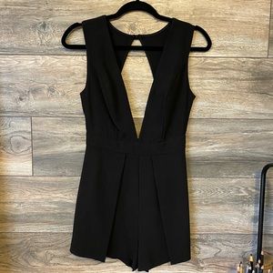 Black V-neck, open back romper